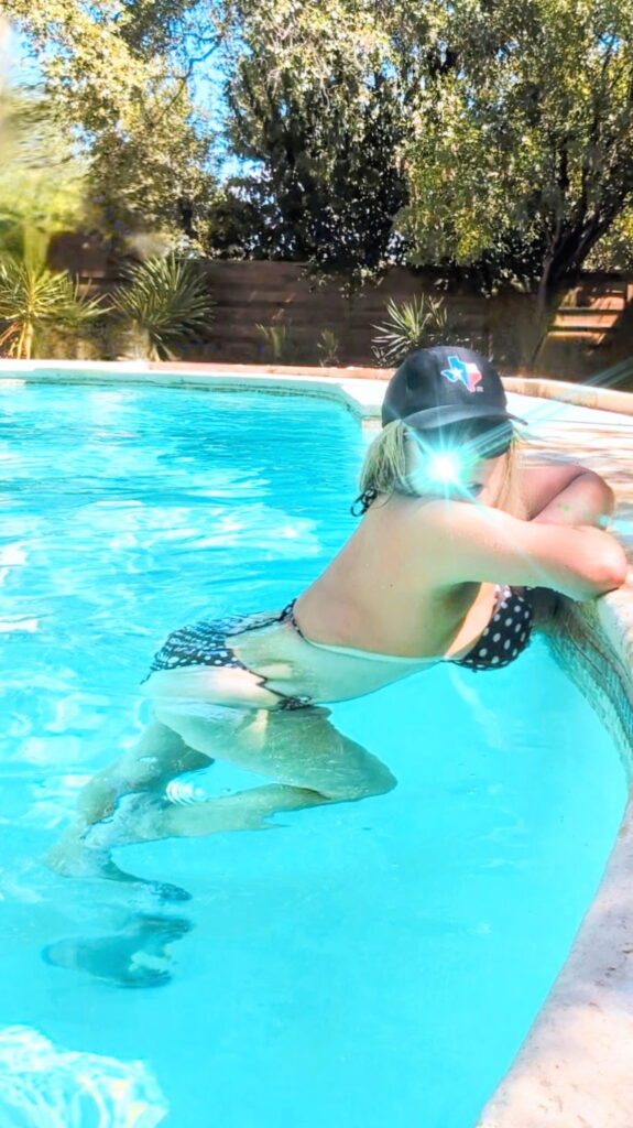 texas hat in pool blurred